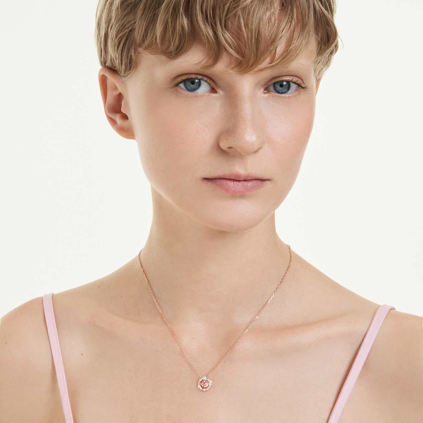 Swarovski Constella pendant, round cut, Dancing Stone, pink, rose gold alloy layer