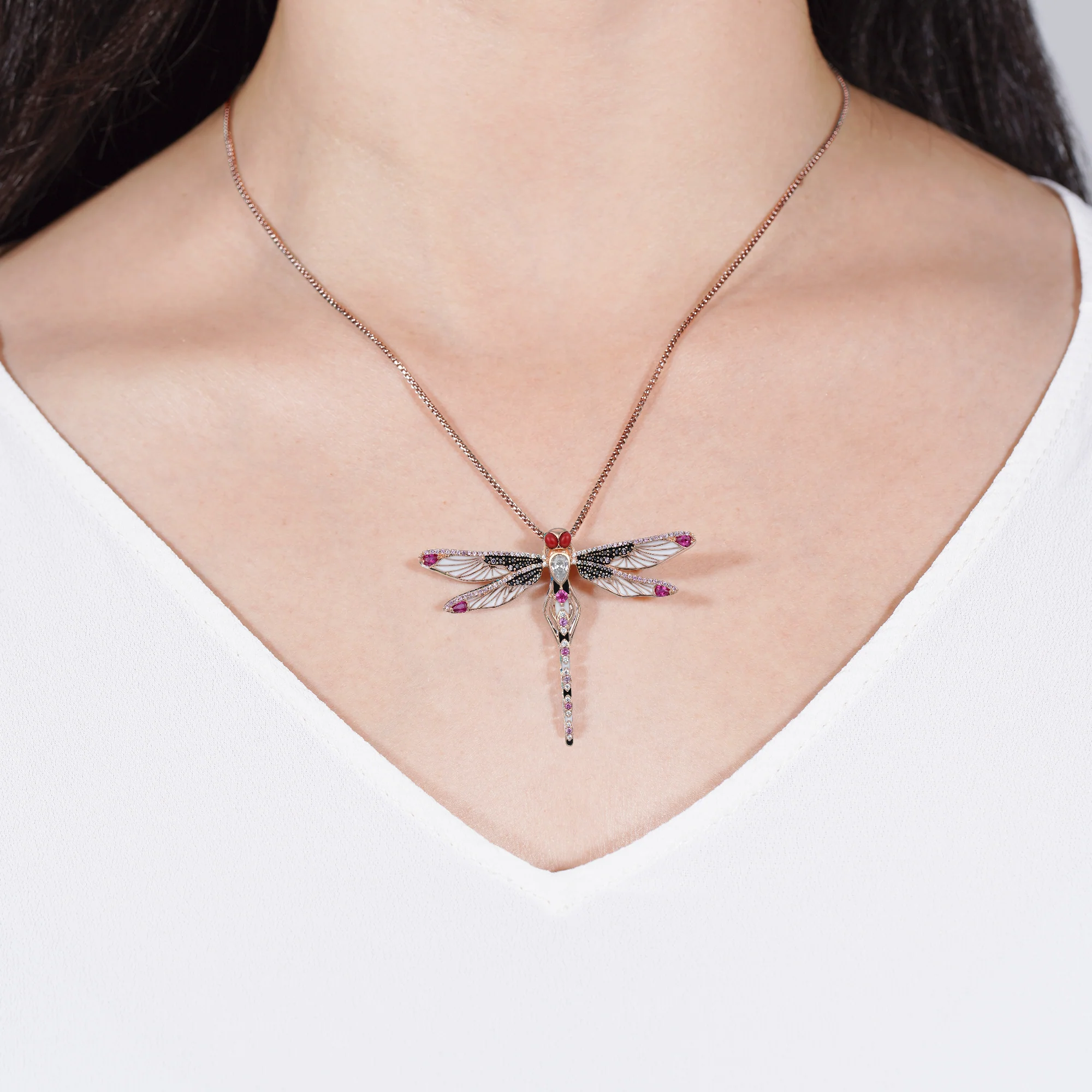 At the time, Nella Dragonfly pendant, rose gold plated with white enamel, dark zirconia