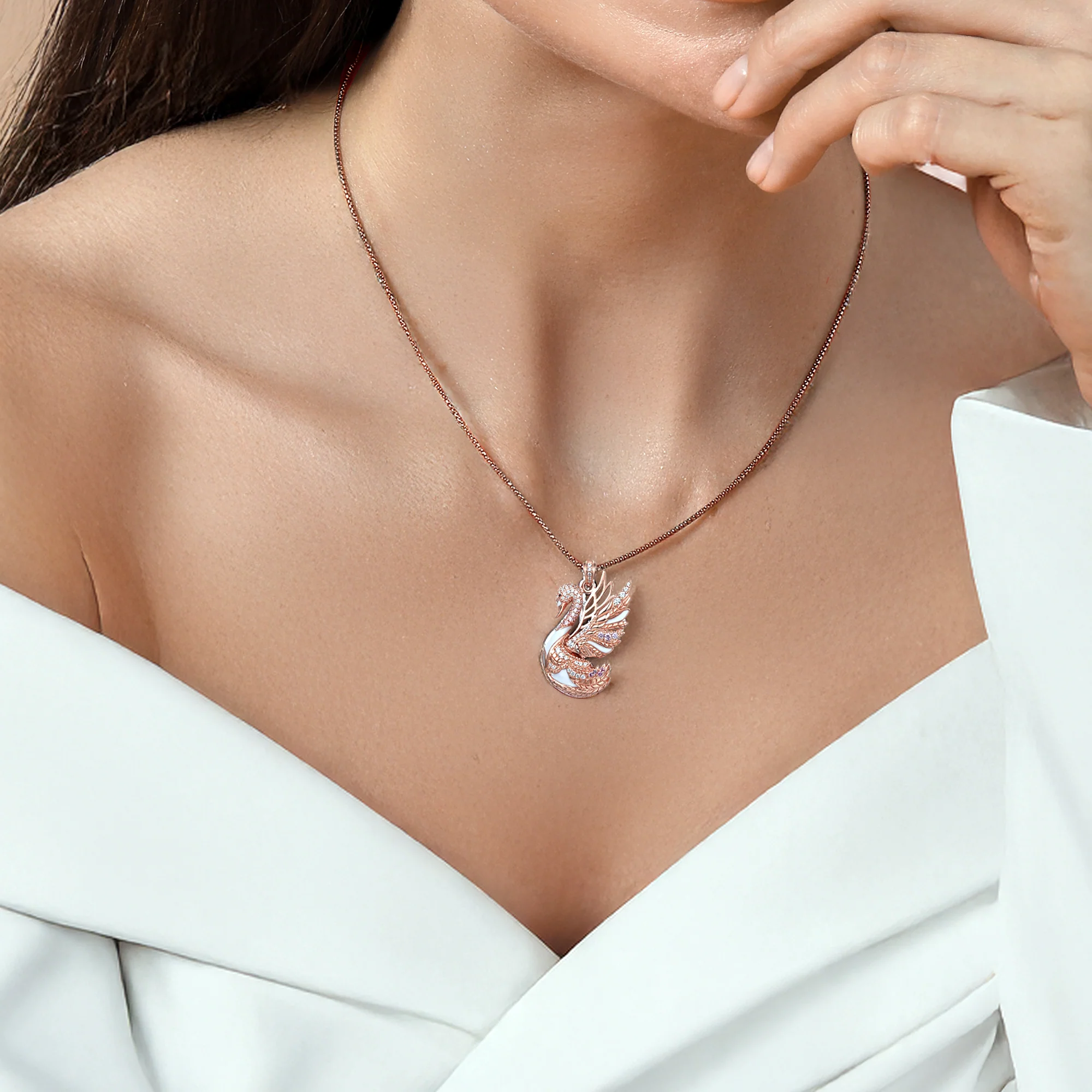 At the time, Selena Swan pendant, rose gold plated with white enamel and sparkling cubic zirconia